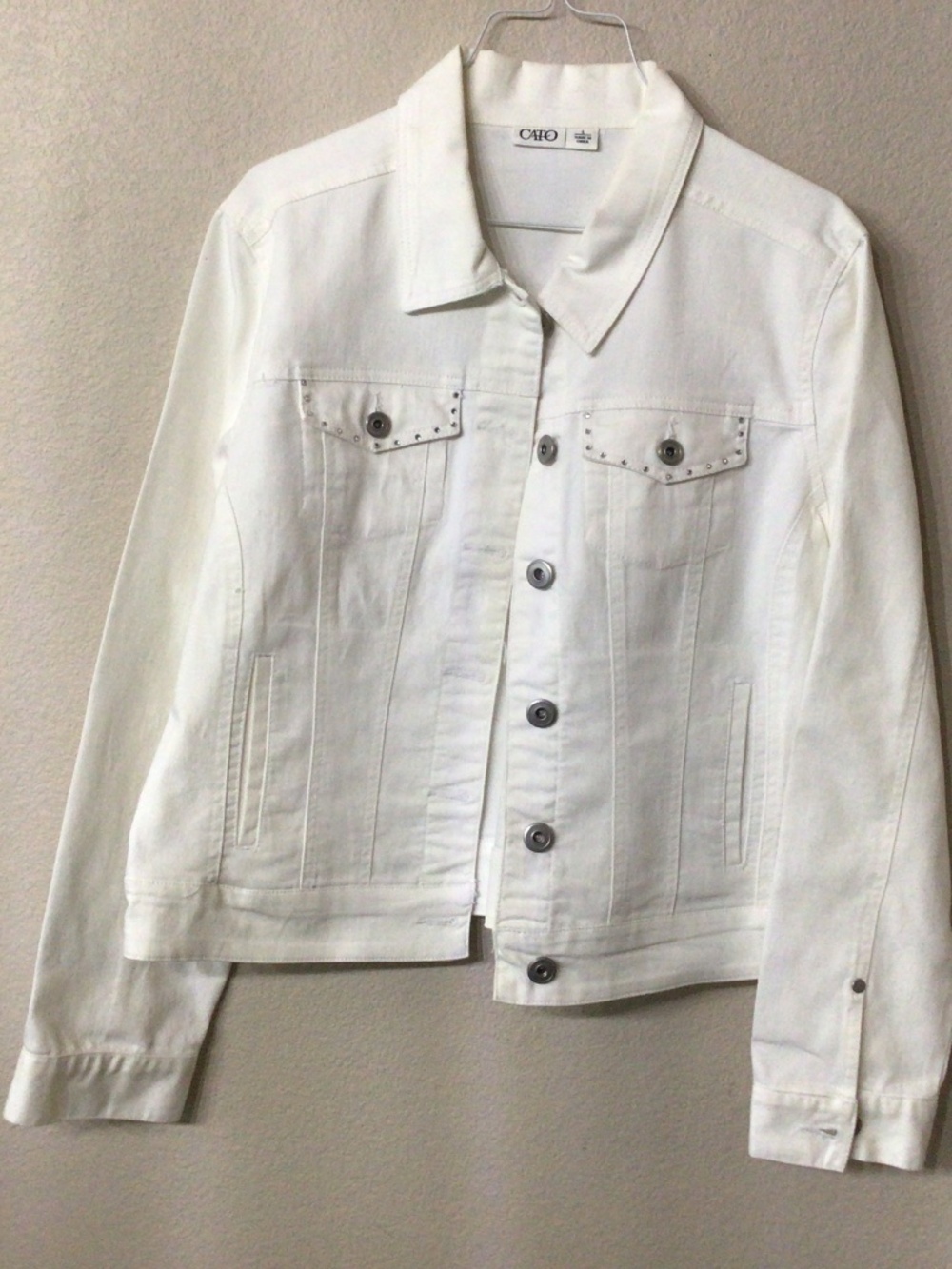 Cato white denim jacket with rhinestones on pockets. Size large great shape.